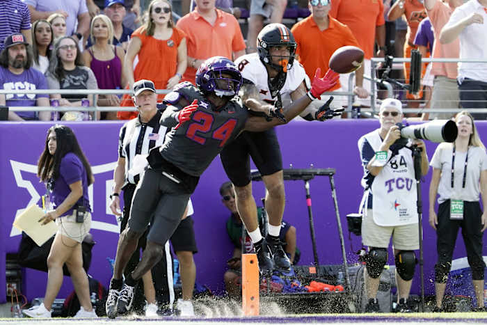 TCU Horned Frogs cornerback Josh Newton (24) breaks up the pass to Oklahoma State Cowboys wide receiver Braydon Johnson (8) during the first half at Amon G. Carter Stadium.